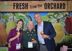 The team of USA Pears proudly shows decorative pears for the holidays. From left to right: Julia Gorby who is the granddaughter of Bob Koehler in the middle. To the right is Tim Beerup.